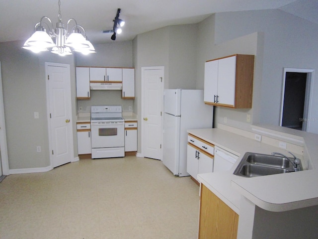24741 Ravello St, Land O Lakes, FL 34639 - kitchen featuring white appliances, under cabinet range hood, a peninsula, a sink, and light countertops