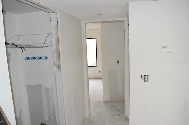 420 Moorings Cove Dr Unit 420, Tarpon Springs, FL 34689 - corridor with concrete floors and a textured ceiling
