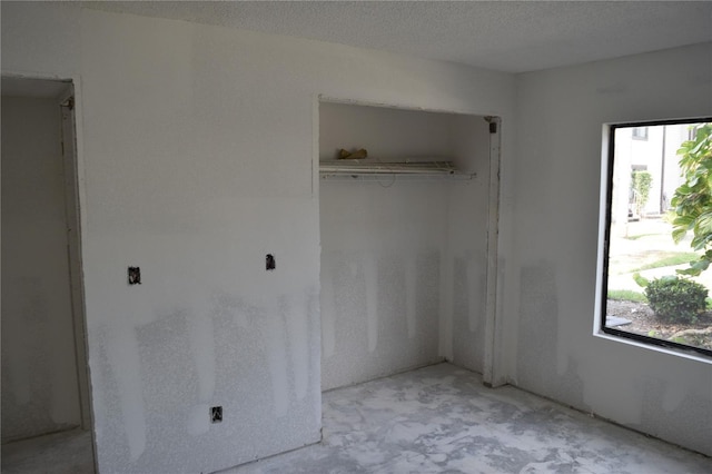 420 Moorings Cove Dr Unit 420, Tarpon Springs, FL 34689 - unfurnished bedroom with multiple windows and a closet