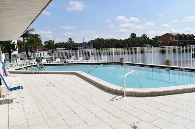 420 Moorings Cove Dr Unit 420, Tarpon Springs, FL 34689 - community pool featuring fence and a patio