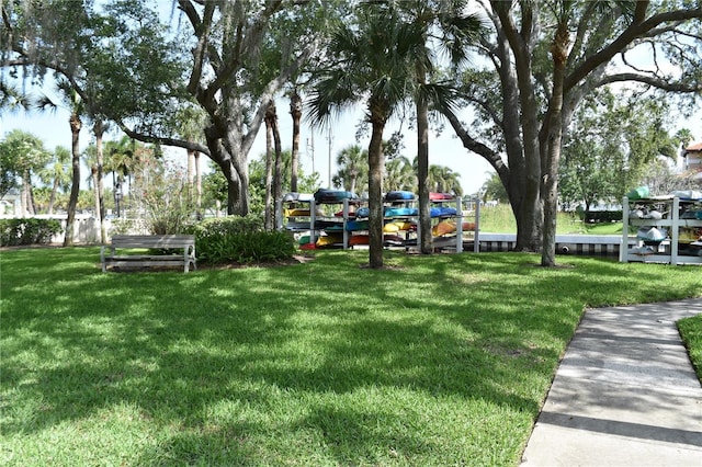 420 Moorings Cove Dr Unit 420, Tarpon Springs, FL 34689 - surrounding community featuring a lawn