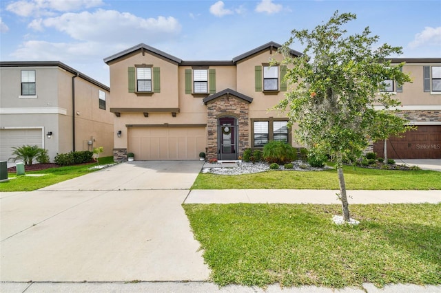 view of front of property with stucco siding, a garage, stone siding, driveway, and a front lawn