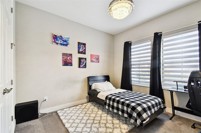 bedroom with carpet and baseboards