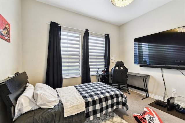 bedroom with carpet and baseboards