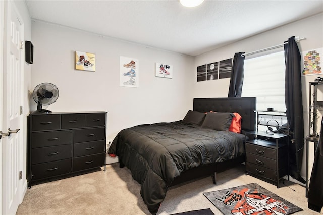 bedroom with light carpet