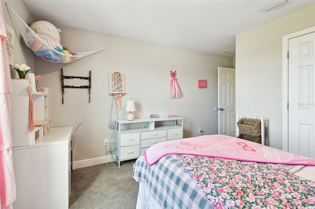 carpeted bedroom featuring baseboards