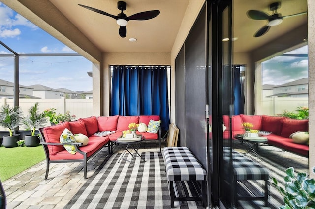 view of patio / terrace featuring outdoor lounge area, a ceiling fan, and fence