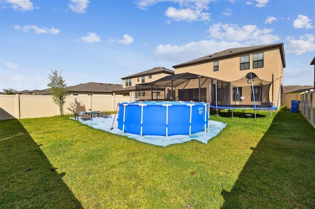 view of pool featuring a trampoline and a patio area