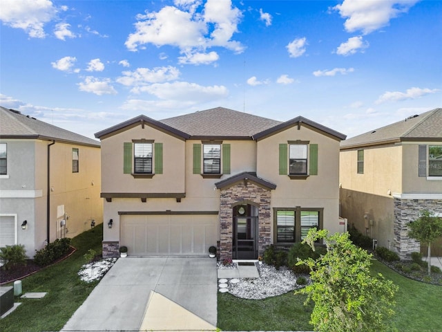 traditional-style home with stucco siding, a garage, concrete driveway, and stone siding