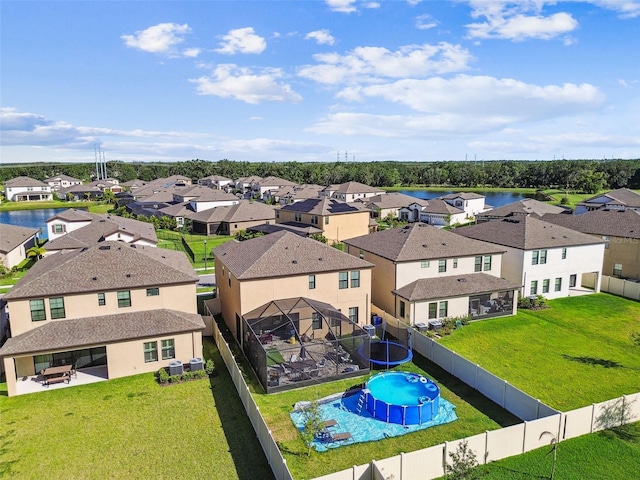 aerial perspective of suburban area with a nearby body of water