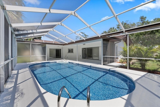 5507 Nimitz Rd, New Port Richey, FL 34652 - outdoor pool with a patio and glass enclosure