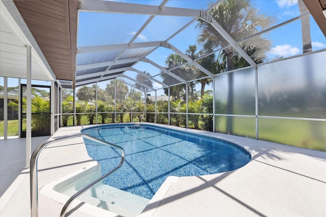 5507 Nimitz Rd, New Port Richey, FL 34652 - outdoor pool with a patio and glass enclosure
