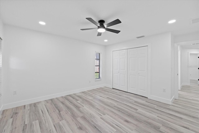 5507 Nimitz Rd, New Port Richey, FL 34652 - unfurnished bedroom with light wood-style flooring, a closet, baseboards, recessed lighting, and ceiling fan