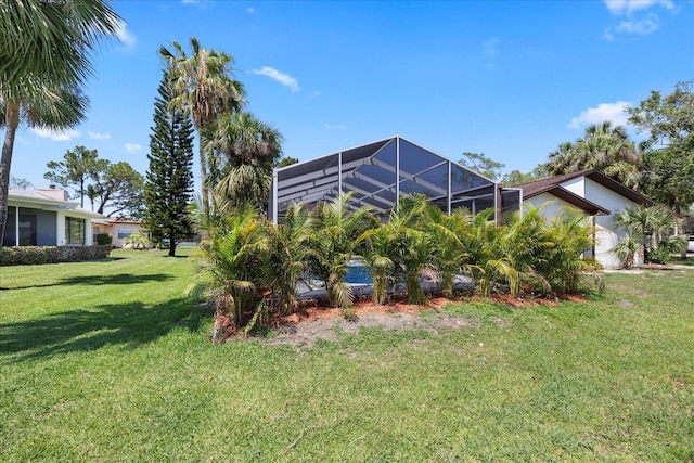 5507 Nimitz Rd, New Port Richey, FL 34652 - view of green lawn with a lanai