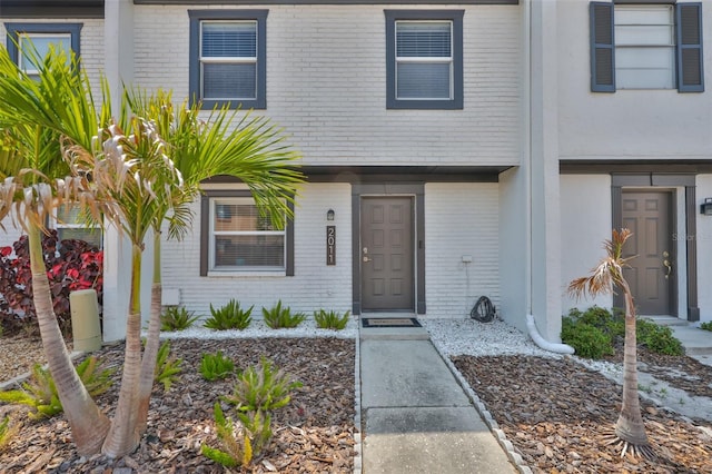 multi unit property featuring brick siding