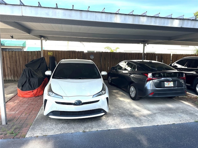 covered parking lot with fence
