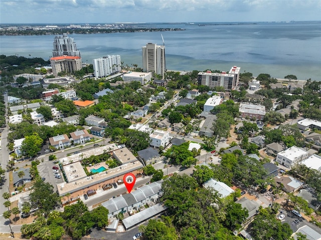 aerial view of property's location with a large body of water