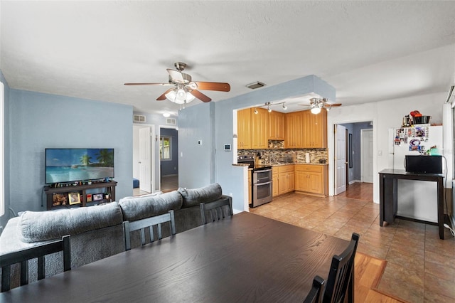 dining space featuring a ceiling fan