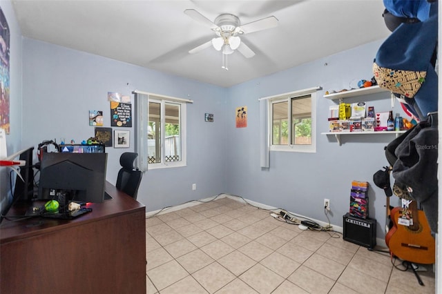 office with ceiling fan and baseboards