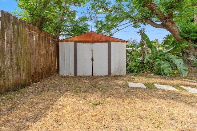 view of shed with fence
