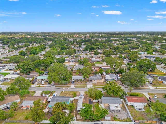 aerial view of property's location with nearby suburban area