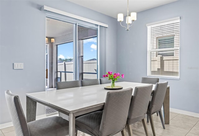 3071 Marine Grass Dr, Wimauma, FL 33598 - dining area featuring a chandelier, baseboards, and light tile patterned flooring