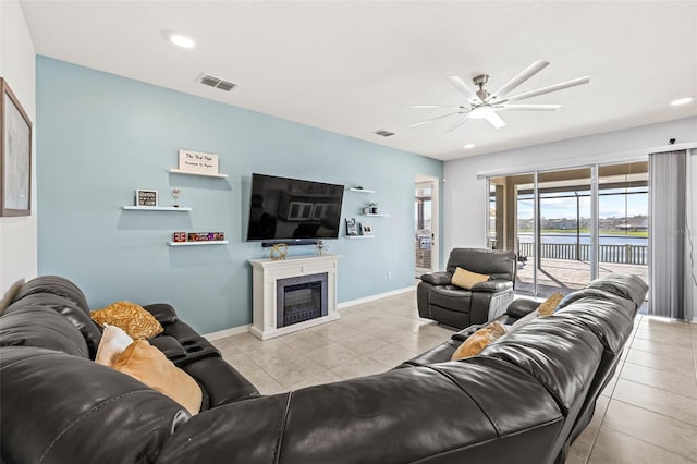 3071 Marine Grass Dr, Wimauma, FL 33598 - living area with a ceiling fan, tile patterned floors, a fireplace, baseboards, and recessed lighting