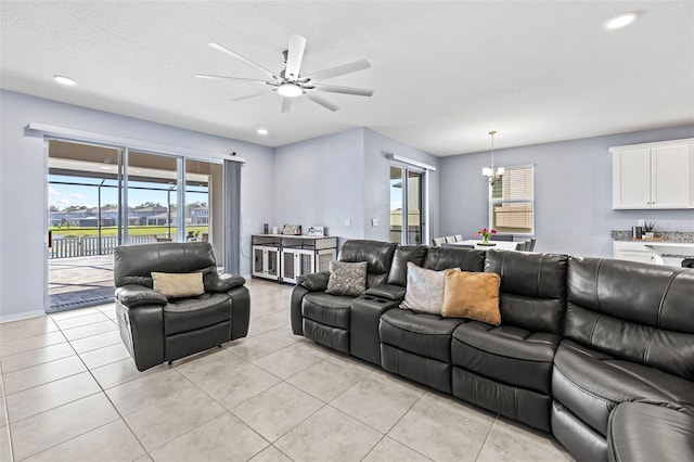 3071 Marine Grass Dr, Wimauma, FL 33598 - living area featuring ceiling fan, light tile patterned floors, recessed lighting, a chandelier, and baseboards
