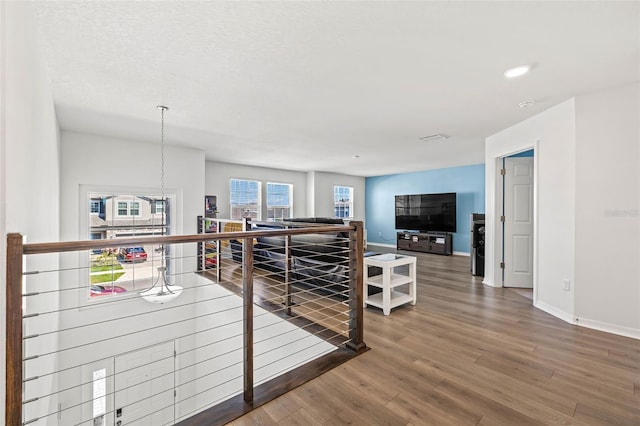 3071 Marine Grass Dr, Wimauma, FL 33598 - hall featuring wood finished floors, an upstairs landing, baseboards, and recessed lighting