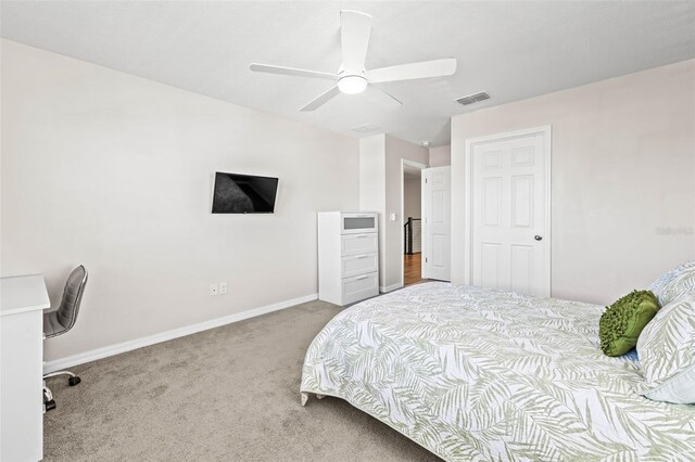 3071 Marine Grass Dr, Wimauma, FL 33598 - carpeted bedroom with baseboards, an office area, and a ceiling fan