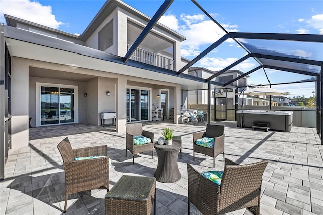 3071 Marine Grass Dr, Wimauma, FL 33598 - view of patio / terrace featuring a hot tub, a lanai, and an outdoor hangout area
