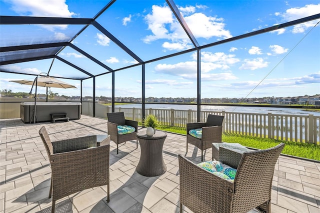 3071 Marine Grass Dr, Wimauma, FL 33598 - view of patio / terrace with a hot tub, a water view, and a lanai