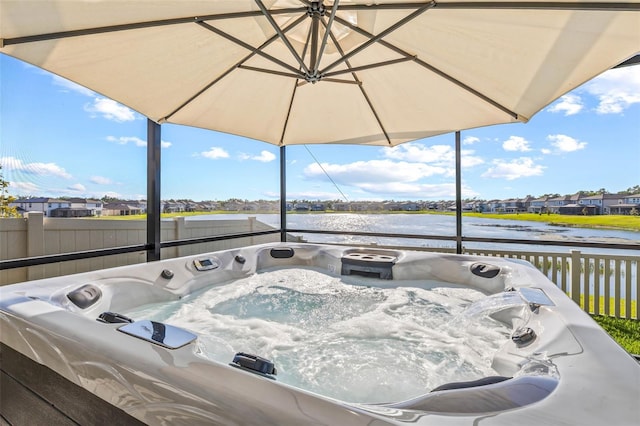3071 Marine Grass Dr, Wimauma, FL 33598 - wooden deck with a water view, a hot tub, and fence