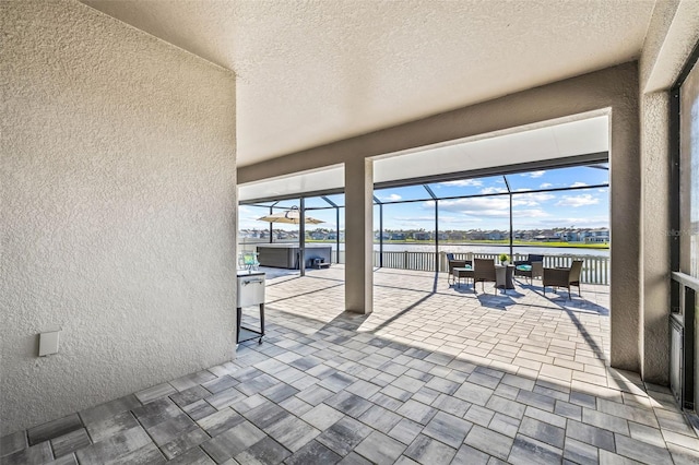 3071 Marine Grass Dr, Wimauma, FL 33598 - unfurnished sunroom featuring a water view and healthy amount of natural light