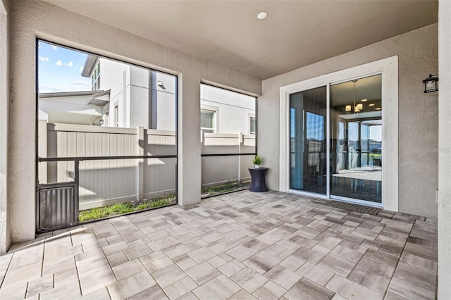 3071 Marine Grass Dr, Wimauma, FL 33598 - unfurnished sunroom featuring a chandelier and healthy amount of natural light