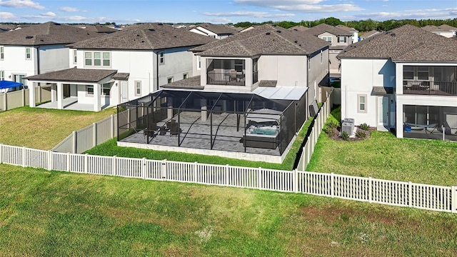 3071 Marine Grass Dr, Wimauma, FL 33598 - rear view of house with a patio, a residential view, glass enclosure, stucco siding, and central AC unit