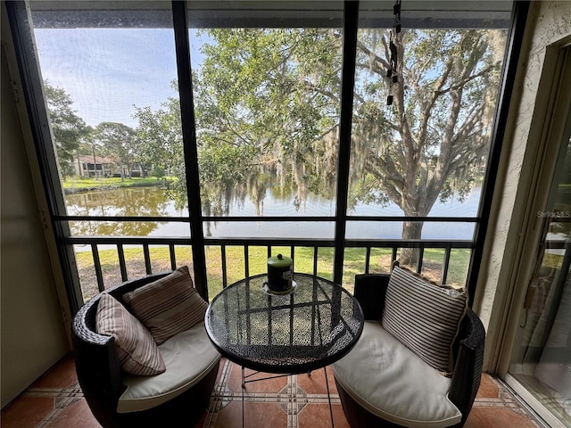 220 Cypress Ln Unit 220, Oldsmar, FL 34677 - sunroom / solarium featuring a water view and plenty of natural light