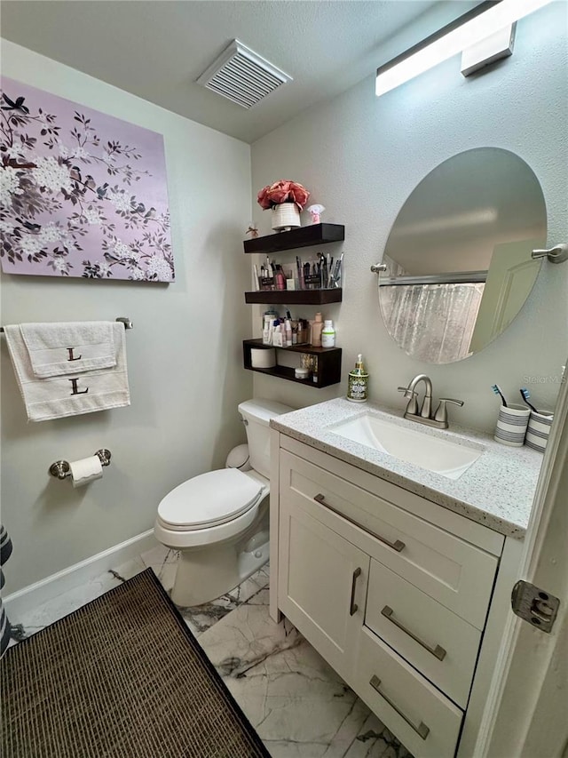 220 Cypress Ln Unit 220, Oldsmar, FL 34677 - bathroom featuring marble finish floors, toilet, and vanity