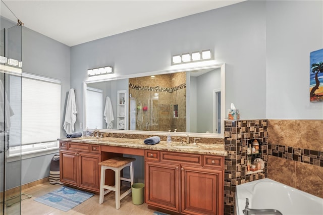 205 Brightwater Dr Unit 101, Clearwater Beach, FL 33767 - bathroom with a shower stall, double vanity, and a bath
