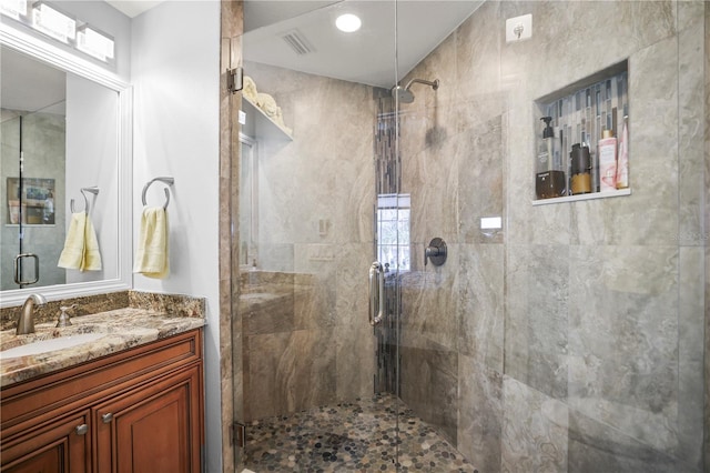 205 Brightwater Dr Unit 101, Clearwater Beach, FL 33767 - full bathroom with a shower stall, vanity, and plenty of natural light