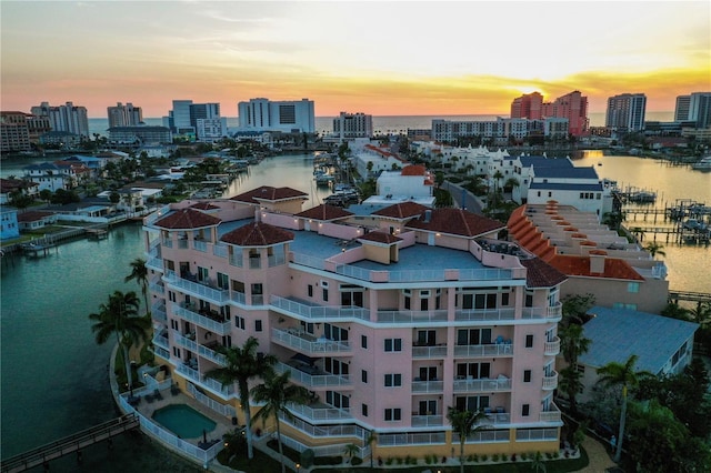 205 Brightwater Dr Unit 101, Clearwater Beach, FL 33767 - aerial view at dusk of a water view and a city view