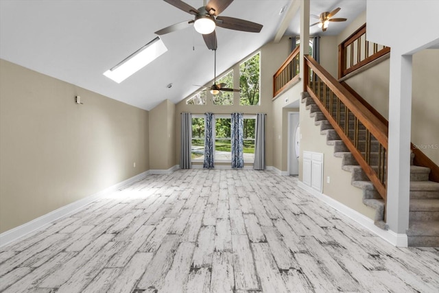 unfurnished living room featuring a ceiling fan, high vaulted ceiling, wood finished floors, baseboards, and stairs