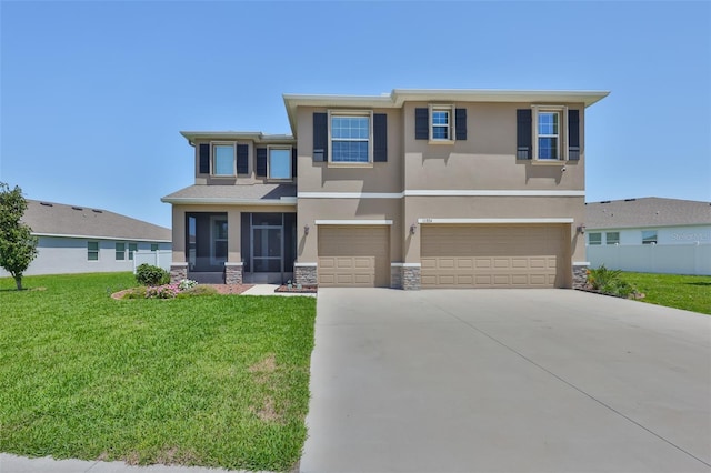 11924 Brighton Knoll Loop, Riverview, FL 33579 - view of front of home featuring stucco siding, an attached garage, concrete driveway, and stone siding