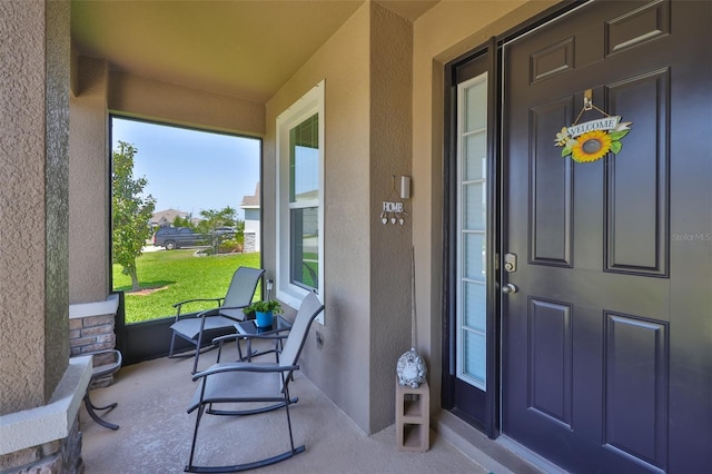 11924 Brighton Knoll Loop, Riverview, FL 33579 - property entrance featuring covered porch and stucco siding