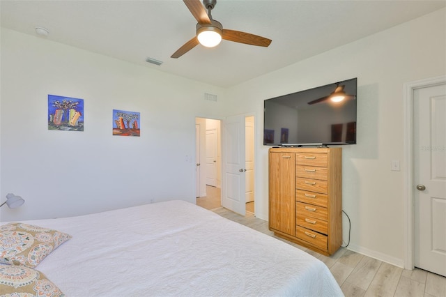 11924 Brighton Knoll Loop, Riverview, FL 33579 - bedroom with light wood-style flooring, a ceiling fan, and baseboards