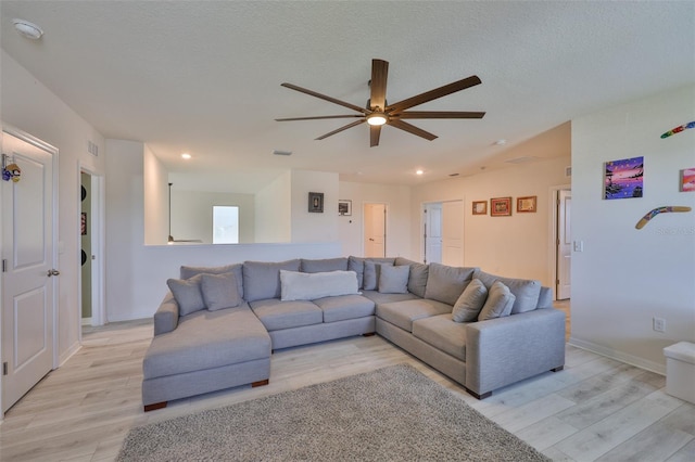 11924 Brighton Knoll Loop, Riverview, FL 33579 - living area with light wood finished floors, ceiling fan, recessed lighting, and baseboards