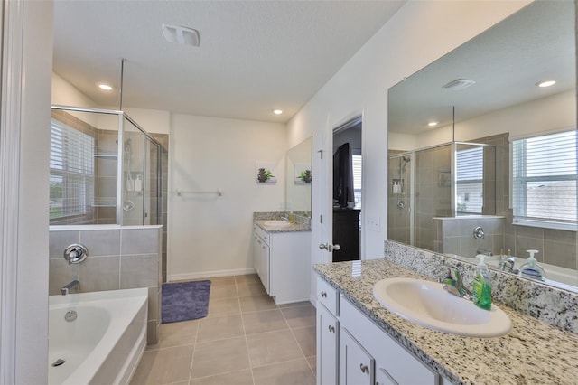 11924 Brighton Knoll Loop, Riverview, FL 33579 - bathroom with a stall shower, tile patterned floors, vanity, a garden tub, and baseboards