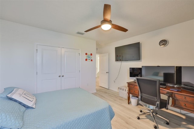 11924 Brighton Knoll Loop, Riverview, FL 33579 - bedroom featuring light wood-type flooring, an office area, a closet, and a ceiling fan