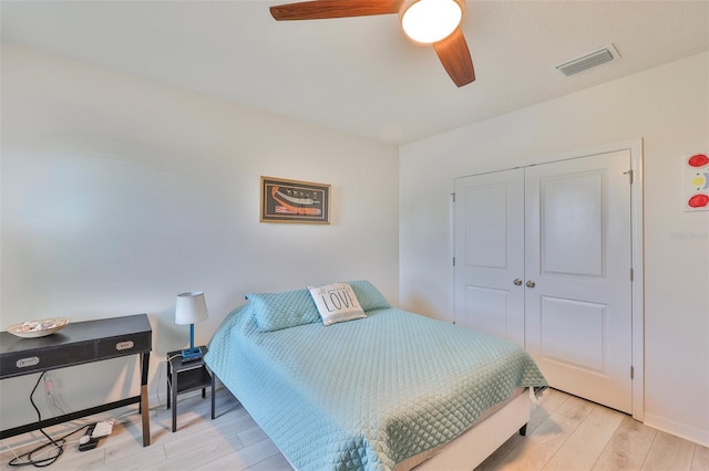 11924 Brighton Knoll Loop, Riverview, FL 33579 - bedroom featuring light wood-type flooring, a closet, a ceiling fan, and baseboards