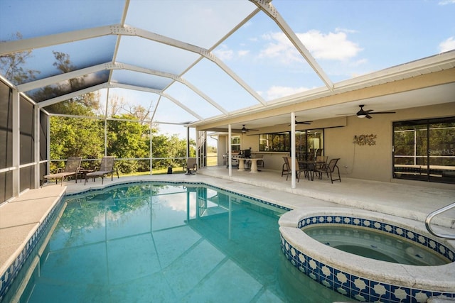 view of pool featuring ceiling fan, a patio area, and a lanai